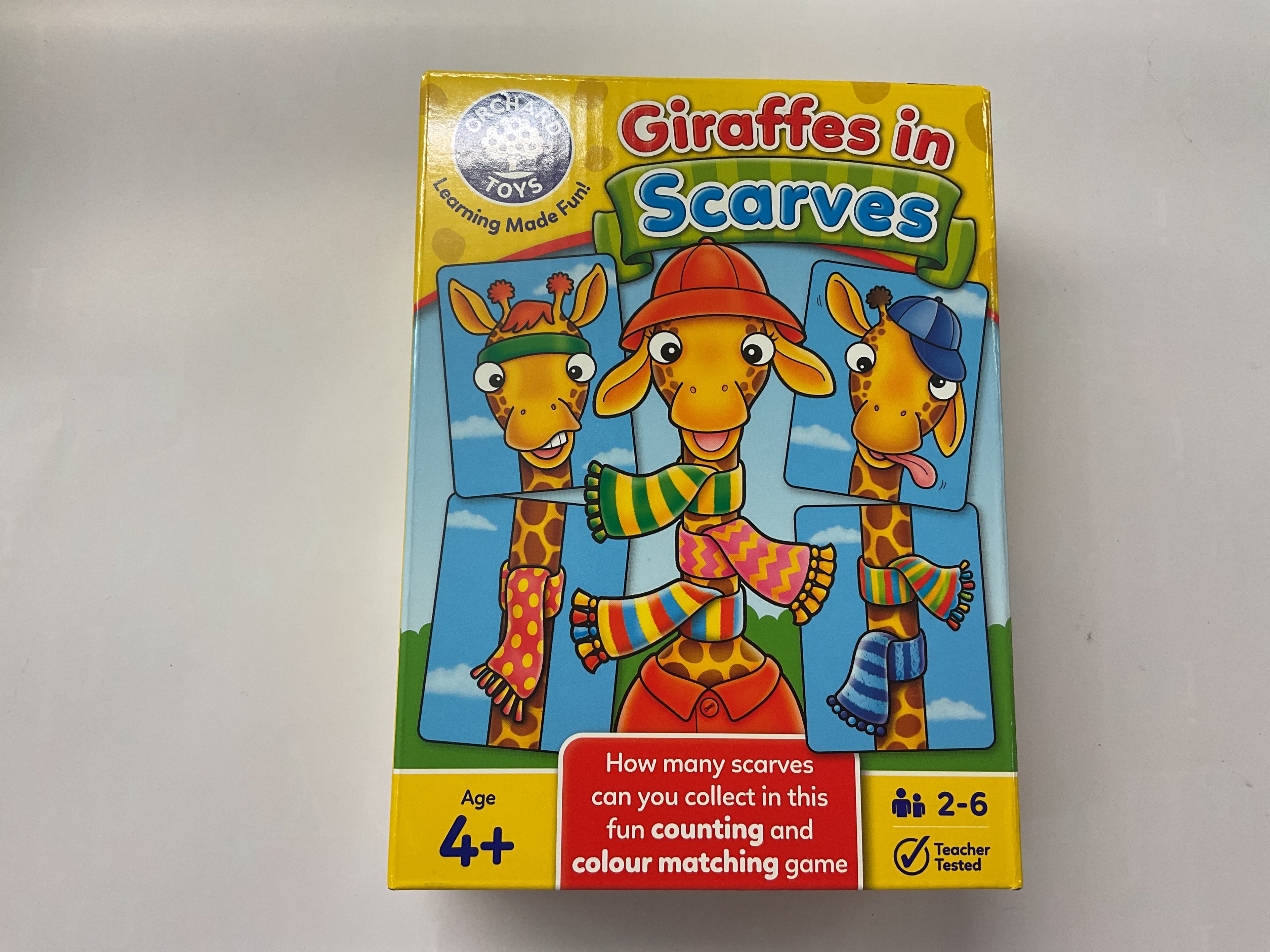 Giraffes in Scarves